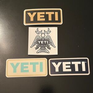 YETI Sticker Collection in Black, Gold, Cream, and Blue